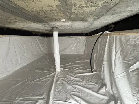 Finished cistern liner installation in Alfred, Ontario with the support post wrapped