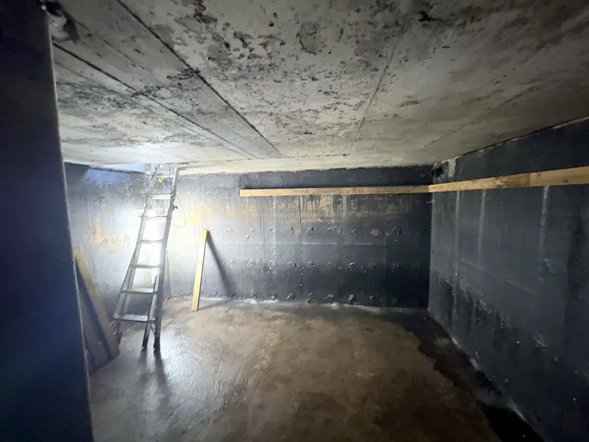 Cistern liner installation: Drained, cleaned and inspected interior, ready for strapping.